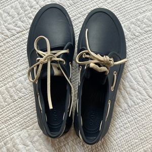 Dual comfort crocs. Blue and white rubber deck shoes..